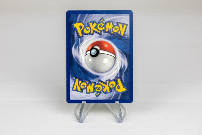 A rare Pokémon card displayed on a stand, showcasing its value for collectors and investors.