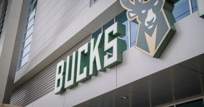 A close-up of the Milwaukee Bucks arena exterior featuring the team’s logo and signage.